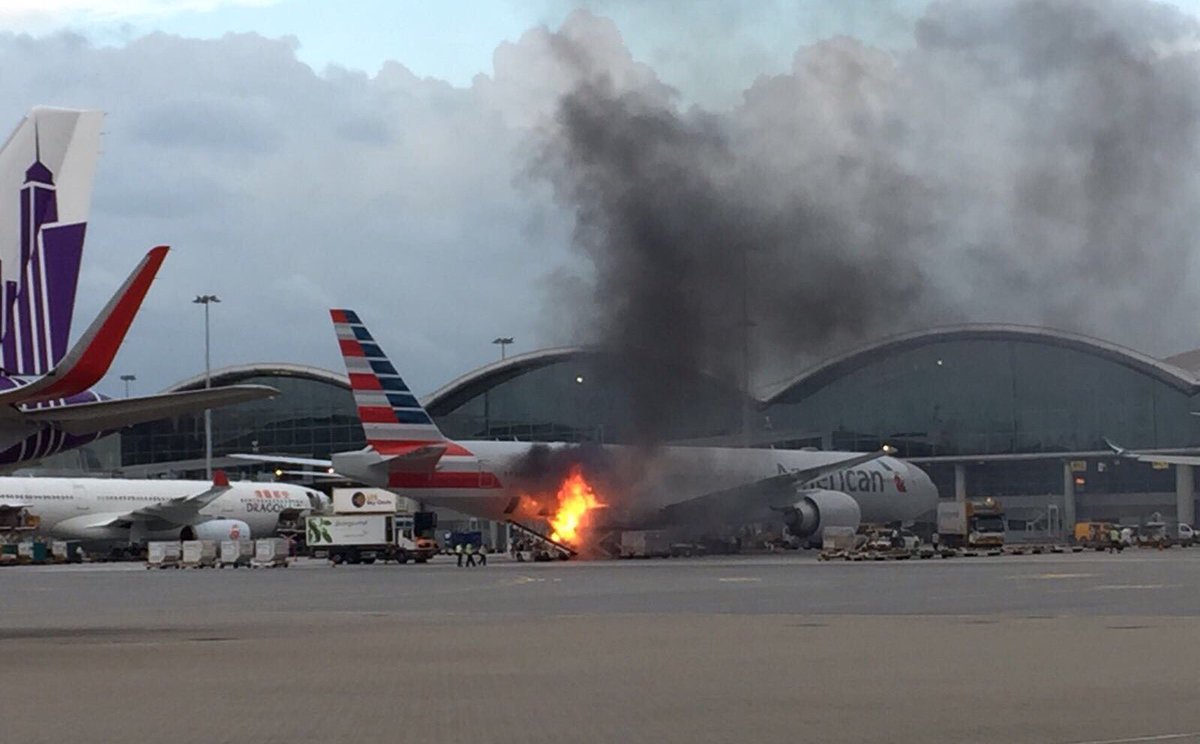 @AmericanAir jet on fire at Hong Kong Int’l Airport   