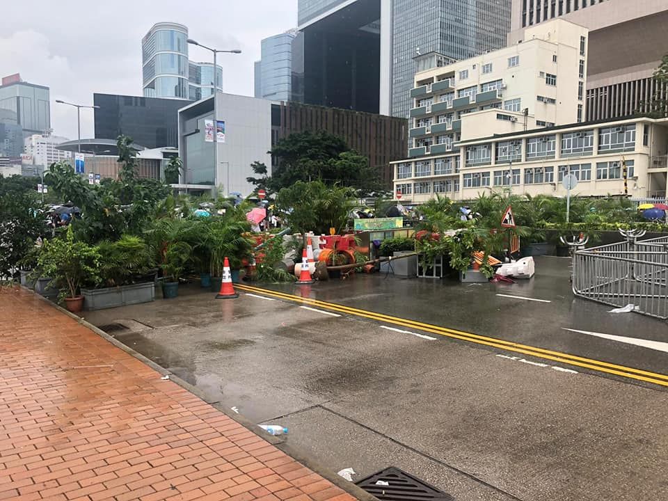 The demonstrators set up roadblocks outside the People's Liberation Army's Hong Kong Army Building (formerly known as Prince of Wales Building).