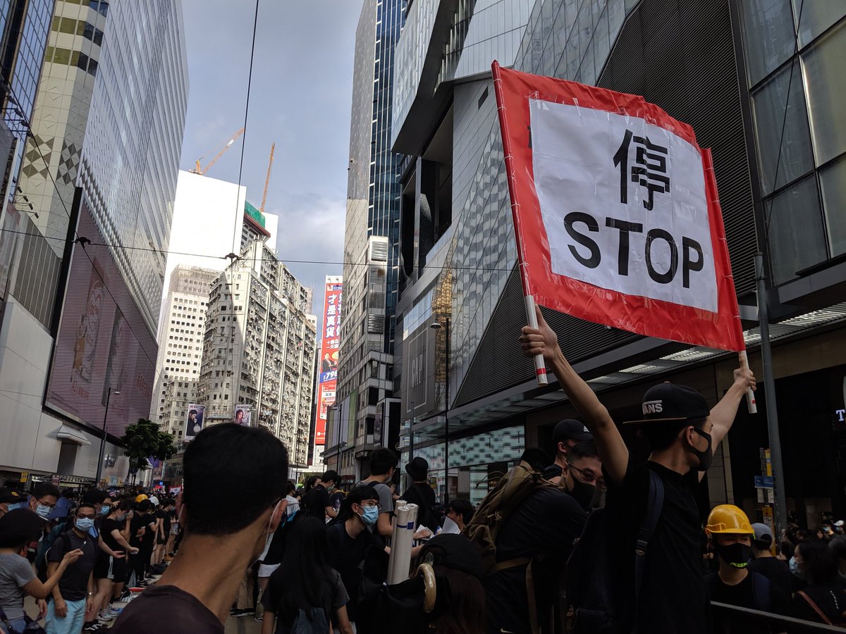 Protesters say they are stopping outside Sogo shopping mall in Causeway Bay for now. They have marched here - without police permission - from Central's Chater Garden.  A supply line has been set up. HongKongProtests #antiELAB