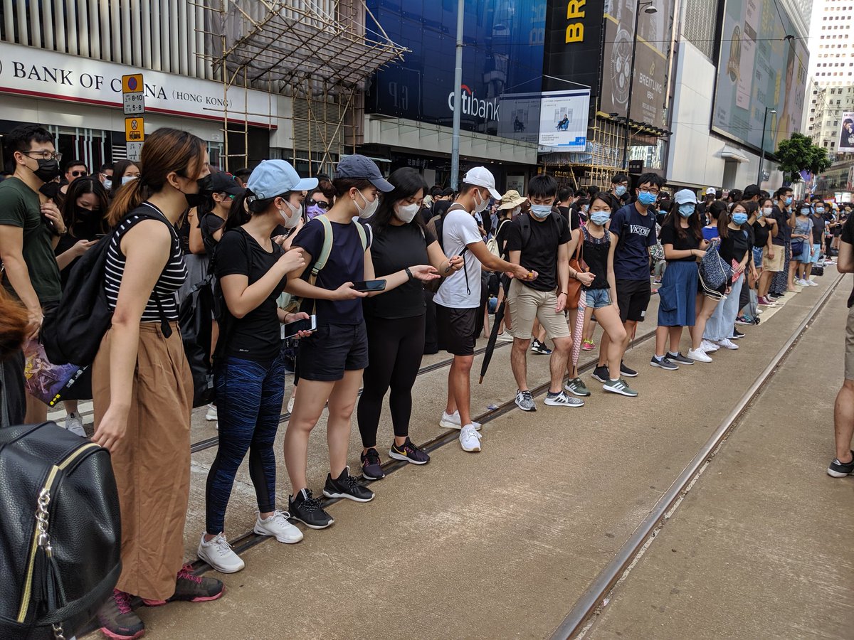 Protesters say they are stopping outside Sogo shopping mall in Causeway Bay for now. They have marched here - without police permission - from Central's Chater Garden.  A supply line has been set up. HongKongProtests #antiELAB