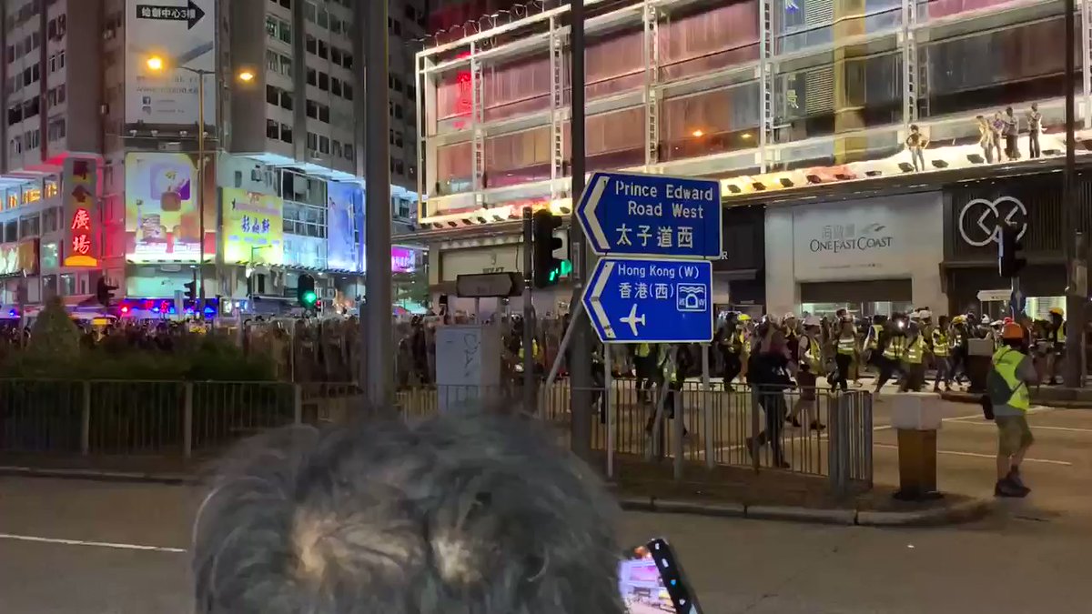 All the police are currently marching down Nathan Rd, pushing back the skirmish lines of protestors