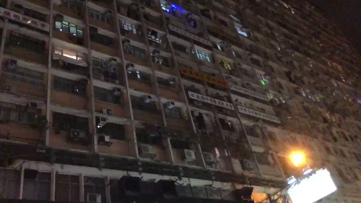 Protesters marching through North Points while pointing lasers into households. Also chanting slogans Liberate HK, revolutions of our times, which is the slogan of the movement