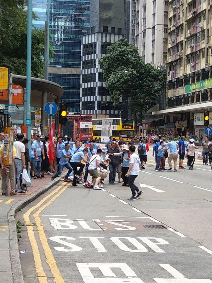 Men in white t-shirts are beating people Fortress Hill