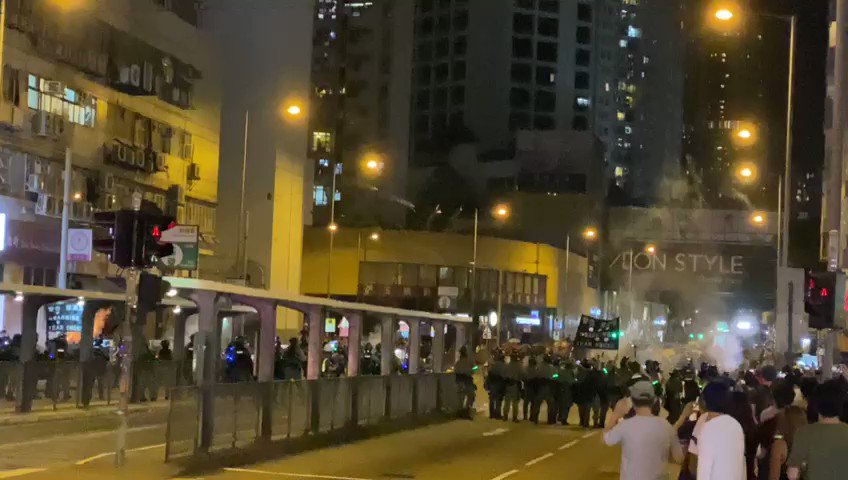 Hong Kong police fire tear gas outside Tai Koo MTR station to disperse protesters.  Video: SCMP/Robert Ng