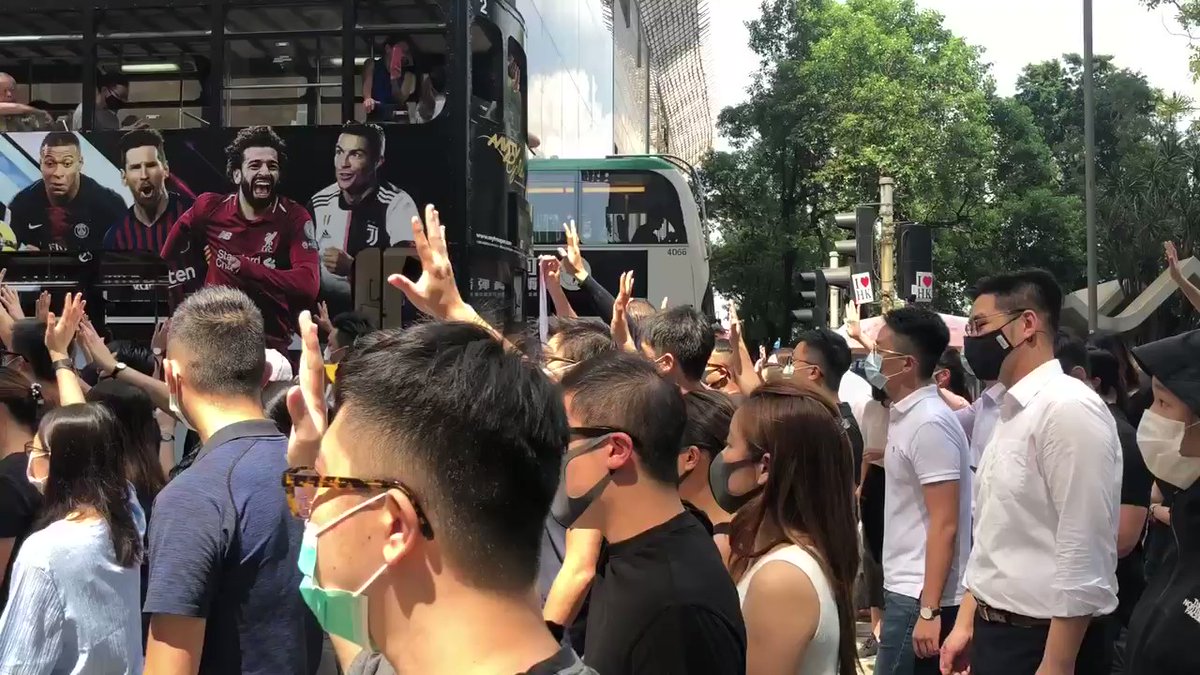 Hundreds of people, with many in suits and face masks, took to the streets in Central during office lunch hours. Many chanted slogans often heard in HKprotests - ahead of reports that hk government may impose an anti-mask law soon