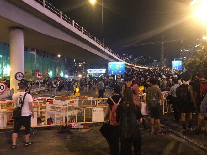 In Causeway Bay, protesters are building barricades near to the the entrance of the Cross-Harbour Tunnel, which connects Hong Kong Island with Kowloon by road 