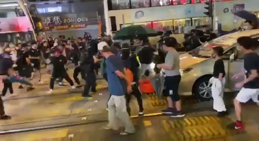 Video of suspected undercover cop being thrown with molotov.
