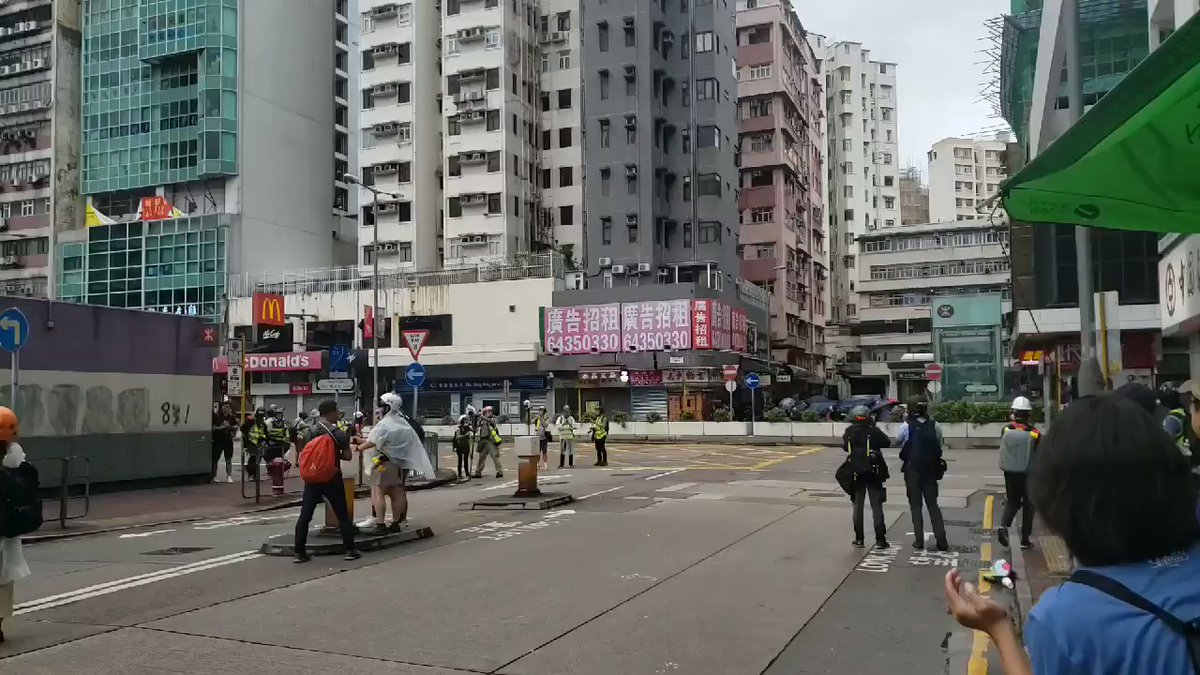 Now on Playing Field Rd at the back of Mong Kok Police Station. Tear gas was fired just on the other side of the station. Irritated citizens urged the police to stopping firing at protesters, You are done after this administration steps down, don't you understand