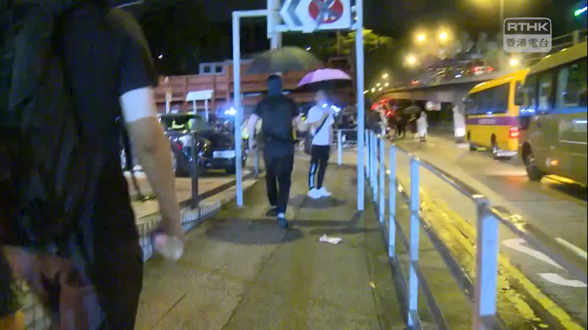 The warning flag is hoisted from the People's Liberation Army barracks in Kowloon Tong in what's believed to have been the first intervention of its kind in HongKong's ongoing protests