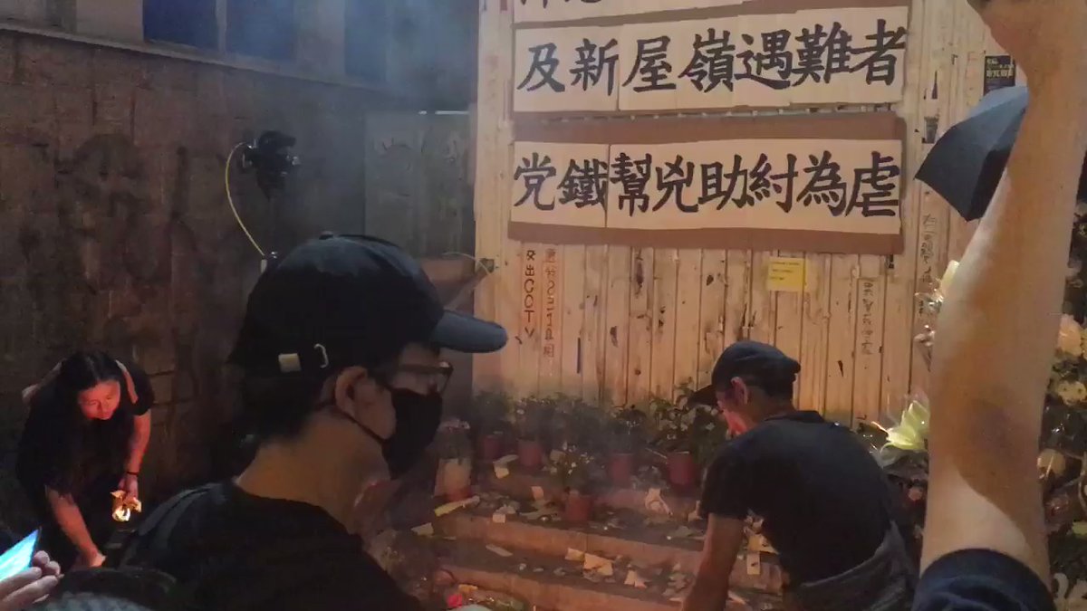 Some 100 people have gathered outside the Mong Kok Police Station for the memorial. Tear gas have been fired