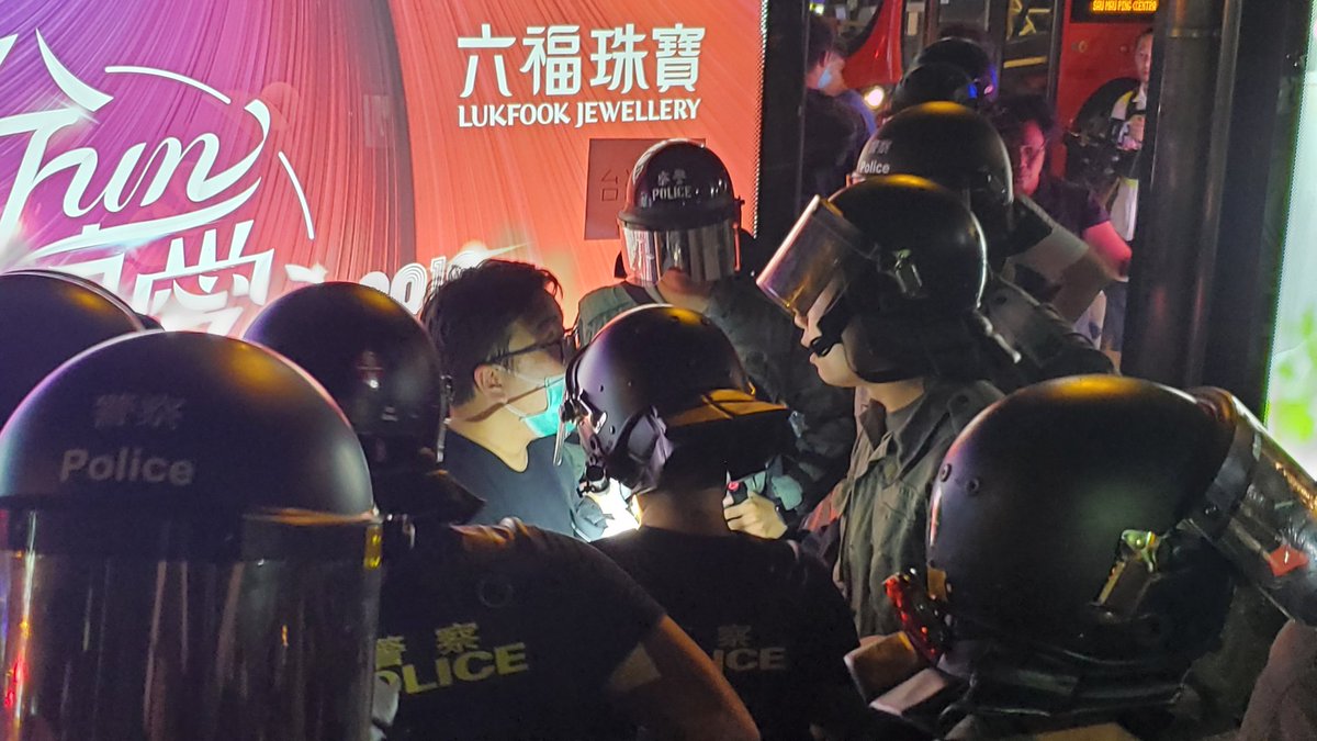 Anger in Tsim Sha Tsui as police conduct stop and search actions outside their station. Protesters chanted Hong Kong people resist. 