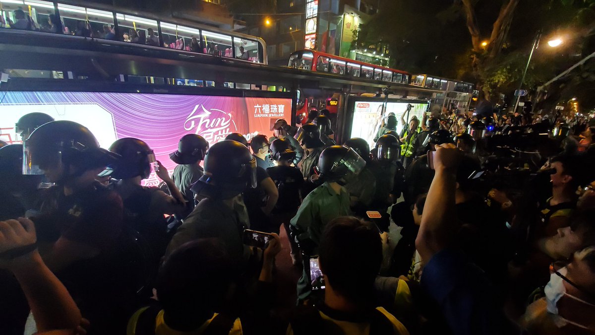 Anger in Tsim Sha Tsui as police conduct stop and search actions outside their station. Protesters chanted Hong Kong people resist. 