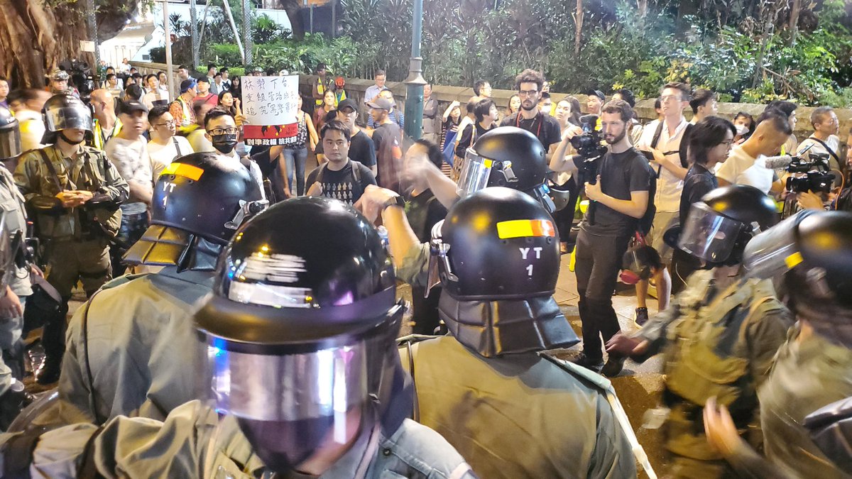 Anger in Tsim Sha Tsui as police conduct stop and search actions outside their station. Protesters chanted Hong Kong people resist. 