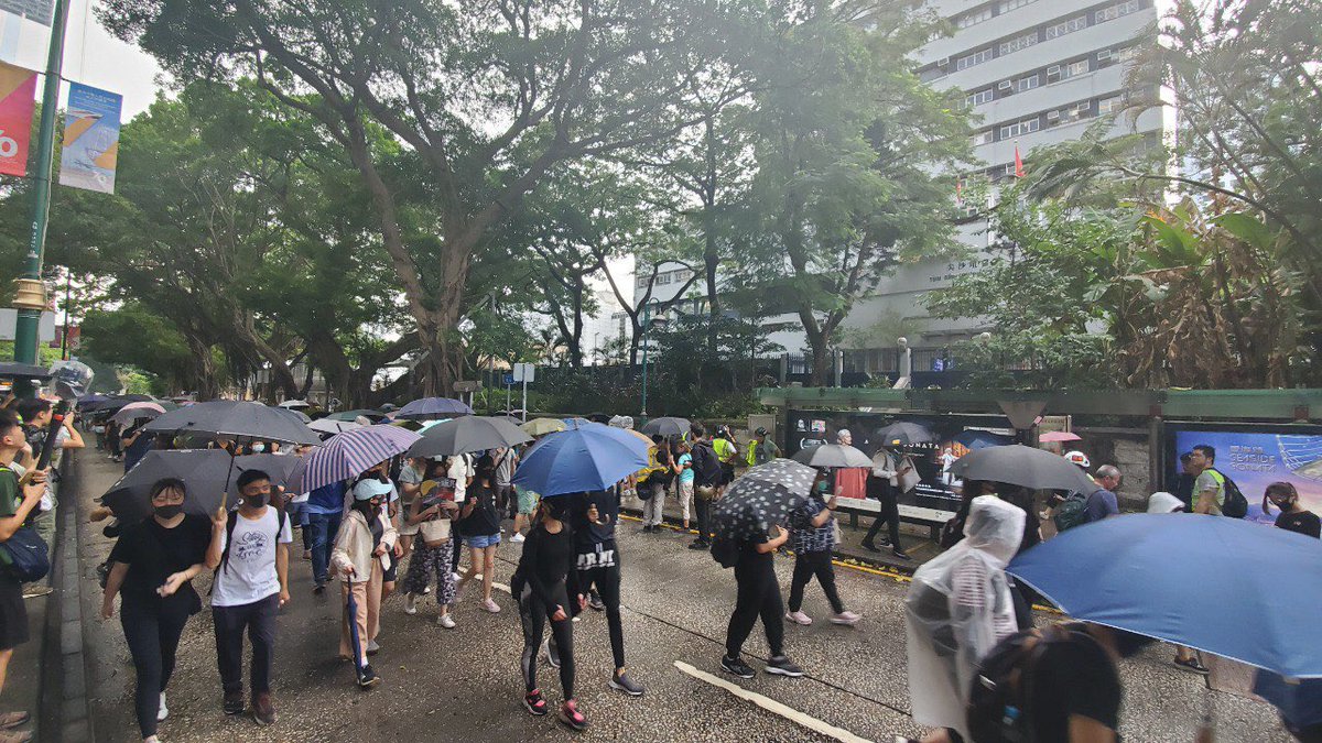 Police have set up security cameras above their Tsim Sha Tsui Station as masked protesters hurl insults at 3:30pm.  Photo: HKFP. 
