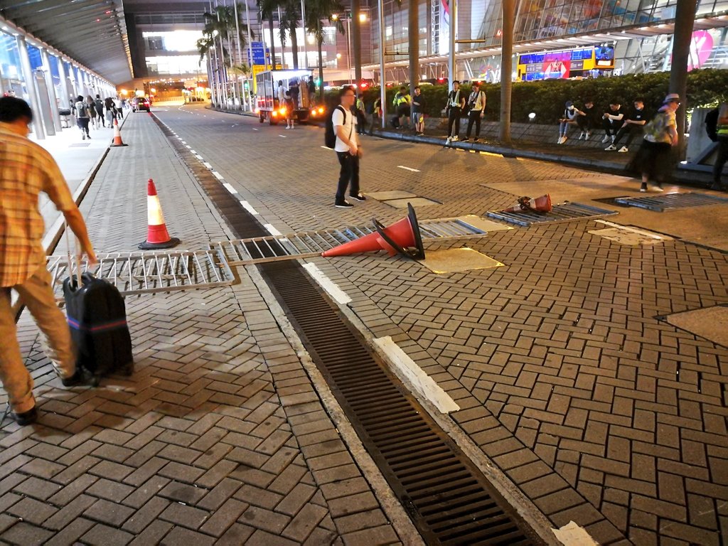 The entrance to the airport express is blocked to traffic by makeshift barriers