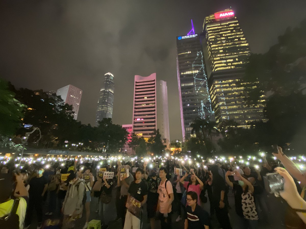 Rally ending with a rendition of 'Glory to Hong Kong', crowd illuminating Chater Garden with their phone lights