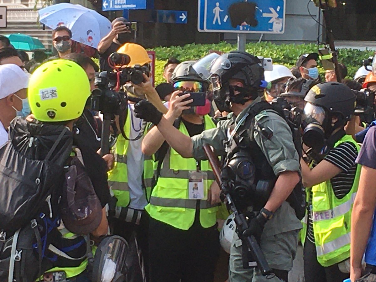 This cop just charged out of the line with his rifle to threaten journalists. Police have backed themselves into a corner with these extremely aggressive tactics.
