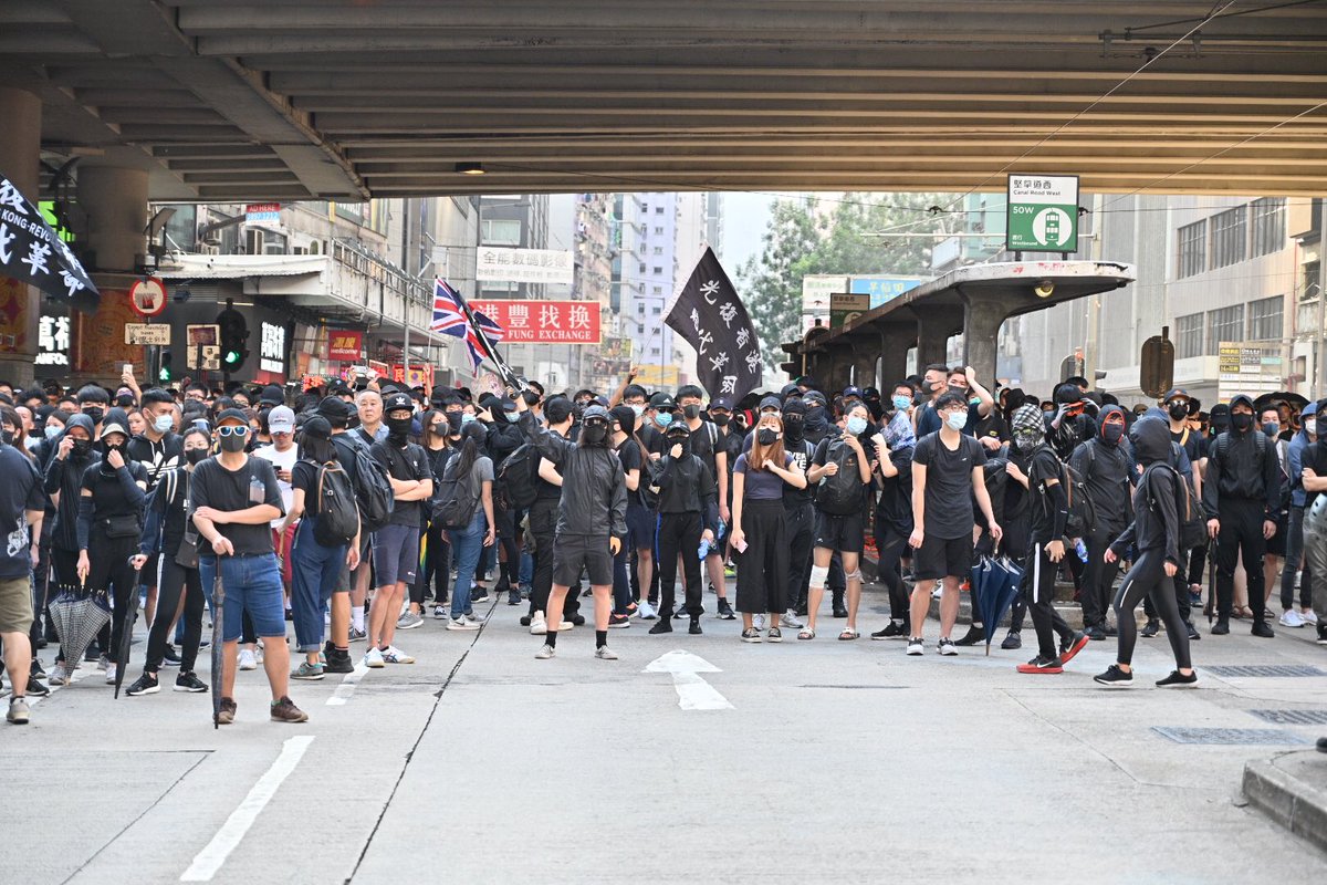 Another group is gathering under the Gooseneck Bridge. Black flag at Great George St