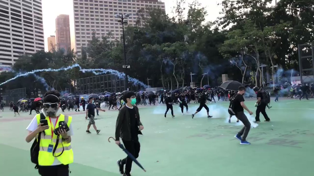Riot police fired tear gas into Victoria Park to drive protesters away from the main road