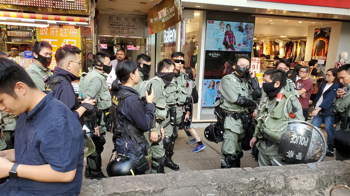 Riot police and tactical unit officers have emerged from Tsim Sha Tsui police station and walked north on Nathan Road, despite police having authorised a protest on Park Lane.  #hongkong