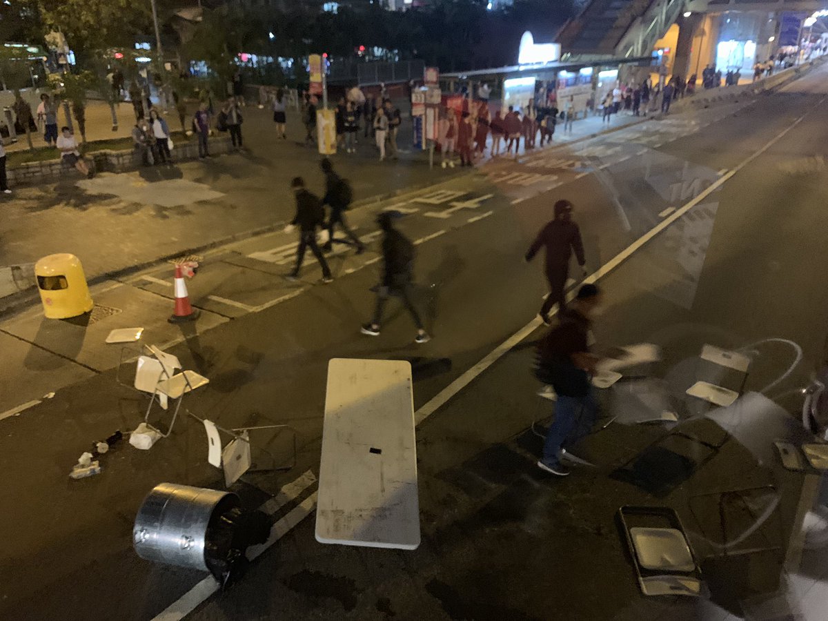 Protestors block a road in Wong Tai Sin