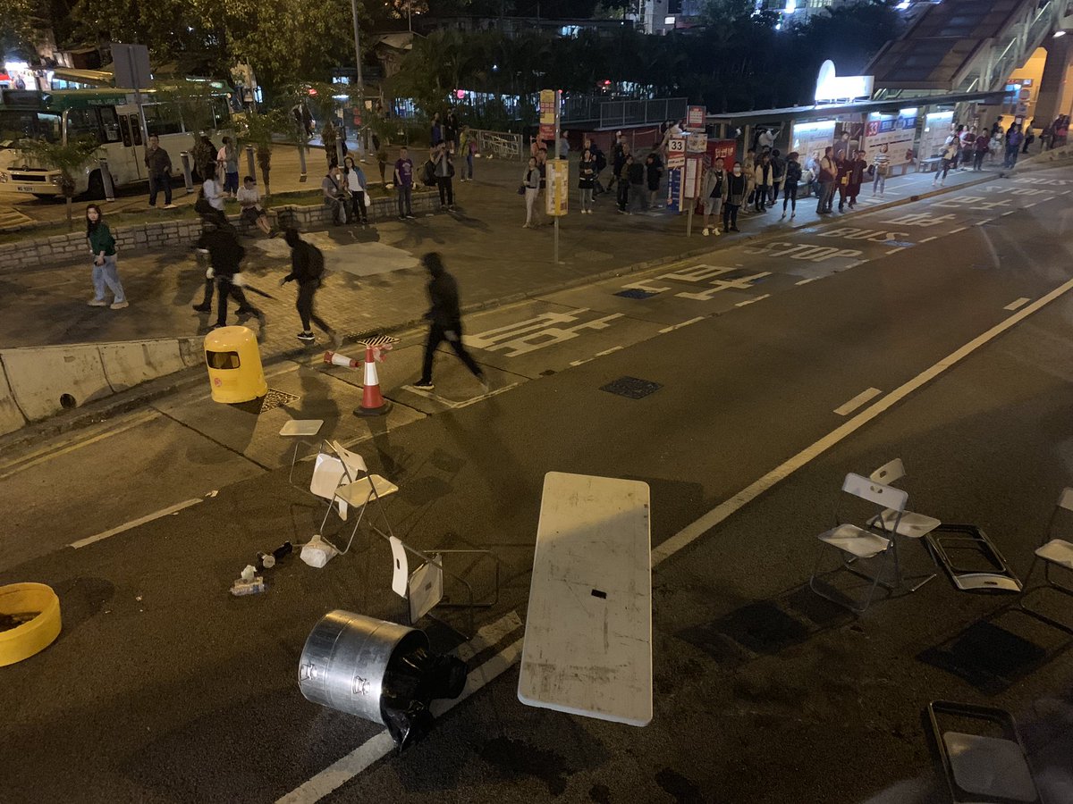 Protestors block a road in Wong Tai Sin