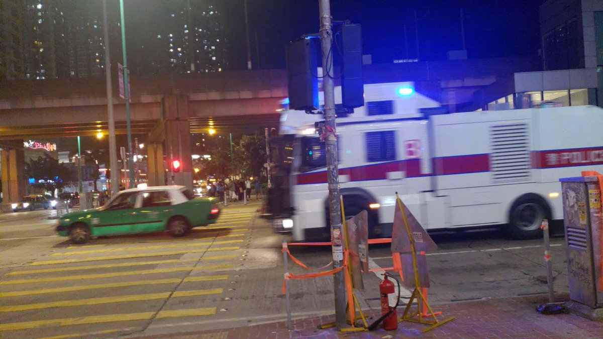 A police water cannon truck is spotted in Tuen Mun on Sunday evening.