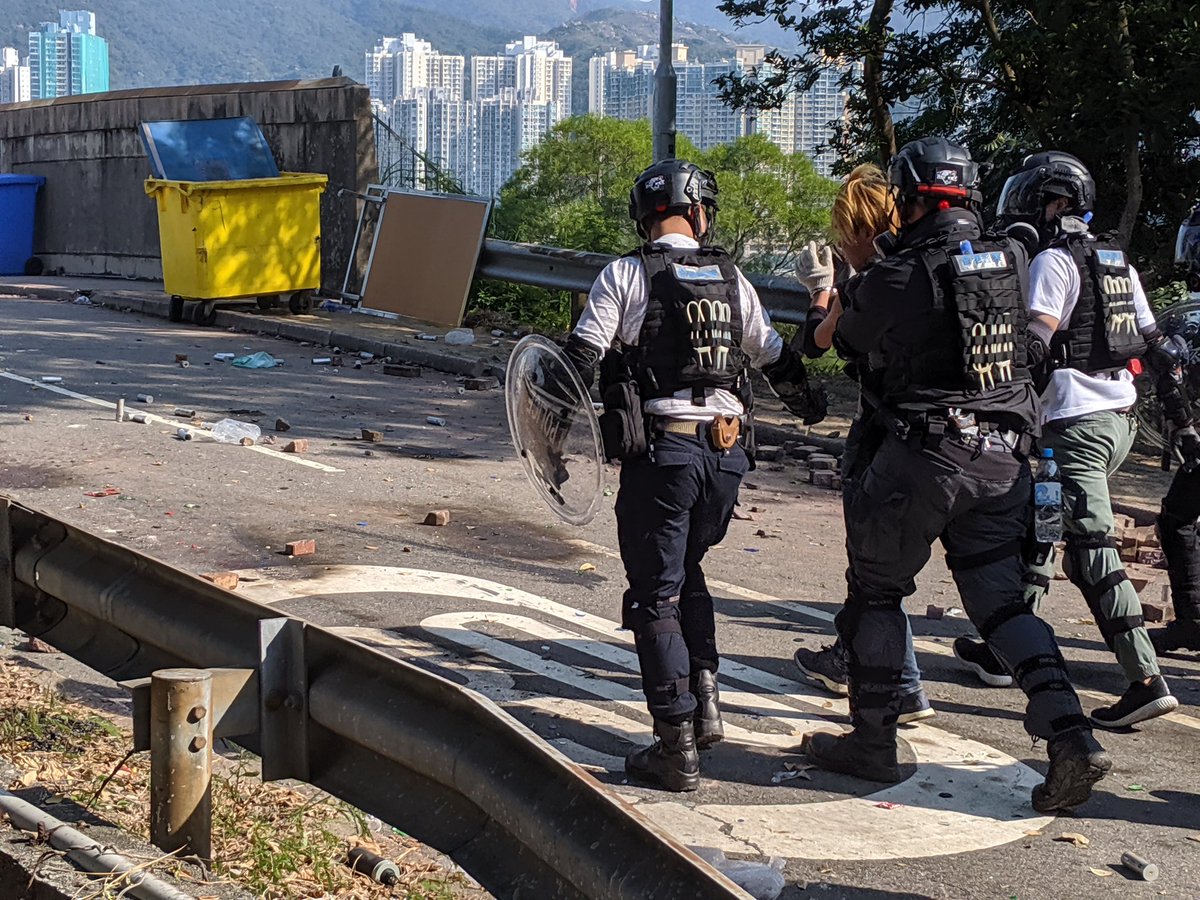 After unloading dozens of tear gas and other rounds at cuhk protesters, police charged and subdued at least three people