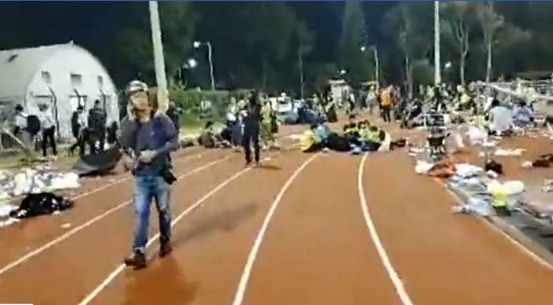 The Chinese University of Hong Kong's main sports ground has become a temporary camp for supplies, injuries and resting journalists and protesters. The No. 2 Bridge - the site of clashes over the day - has been calm for an hour
