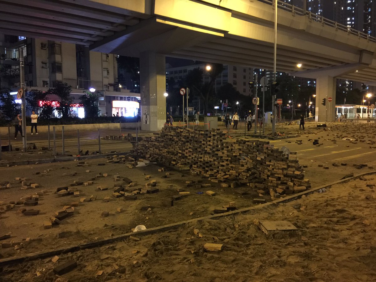 The centre of Sai Wan Ho, where police shot a protester on Monday morning, still looks a bit like a war zone tonight 