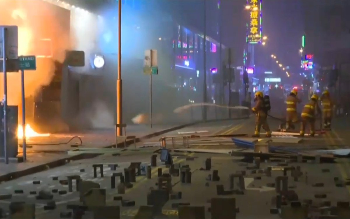 Protesters set fire to a Sa Sa store in Mong Kok after breaking into the cosmetic retail outlet.  
