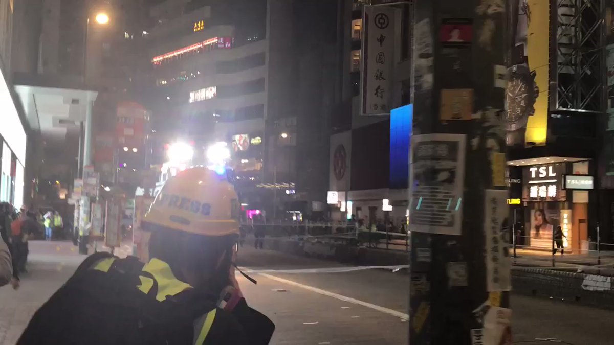 The water canon vehicle is running a course through Causeway Bay, unleashing bursts of pepper spray-infused water where crowds stood (before the canon advanced) on Hennessy and Jardine. As usual, journalists and medics appear to be the only ones hit