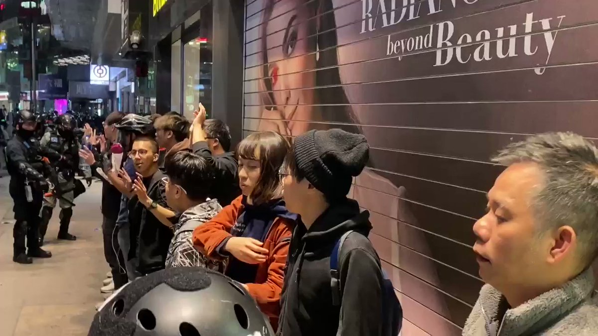 A group of people walked out from where nearly 100 were subdued on Hennessy Road
