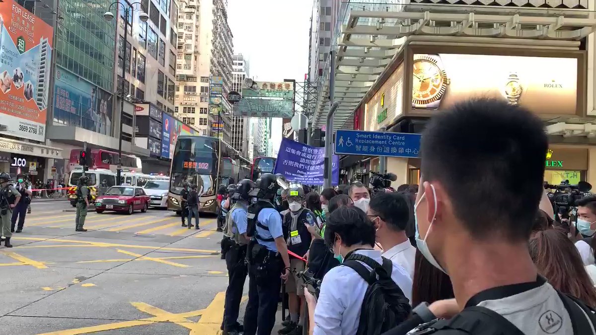 Journos and crowd surrounded again . This is Mong Kok 