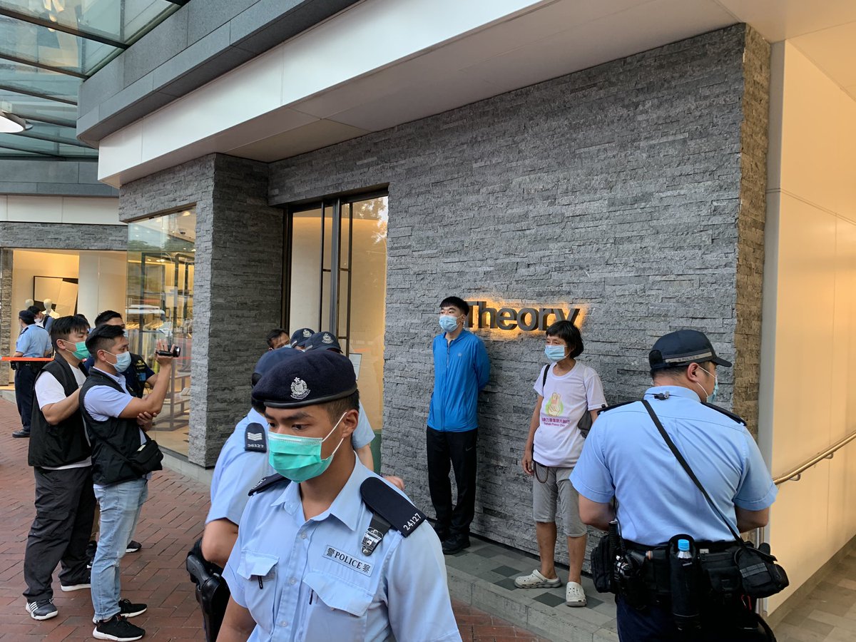 More than 30 police have  pulled David and an elderly woman aside. They were doing nothing other than posing for photos. 