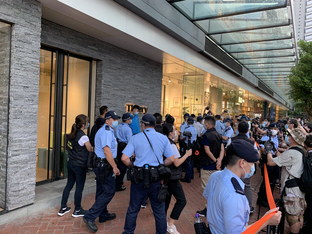 More than 30 police have  pulled David and an elderly woman aside. They were doing nothing other than posing for photos. 
