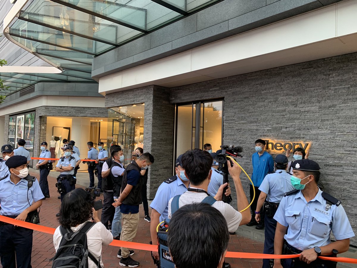 More than 30 police have  pulled David and an elderly woman aside. They were doing nothing other than posing for photos. 
